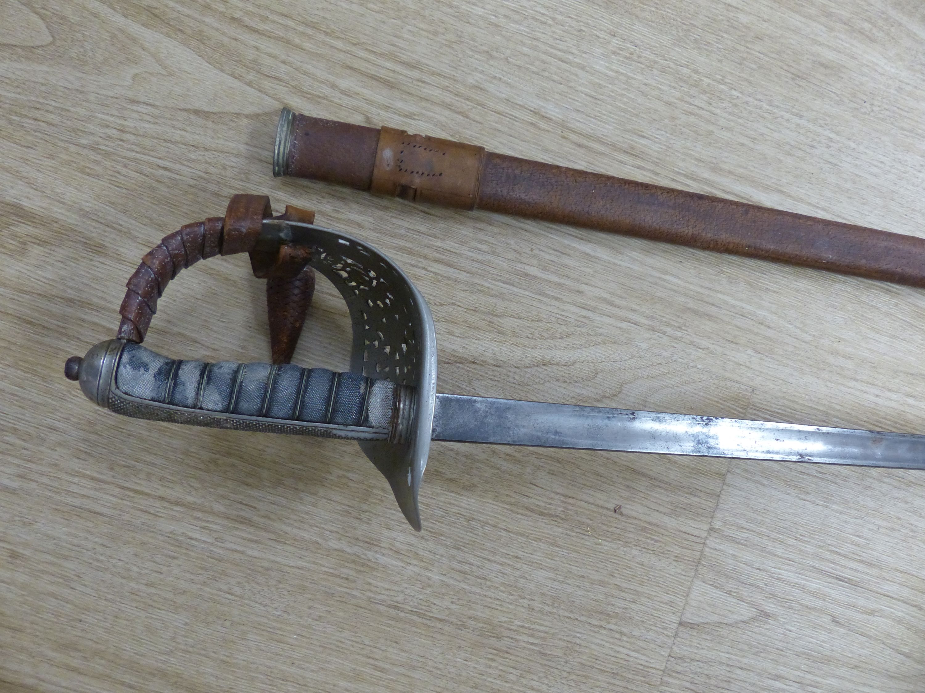 A George V officers dress sword, with a leather scabbard